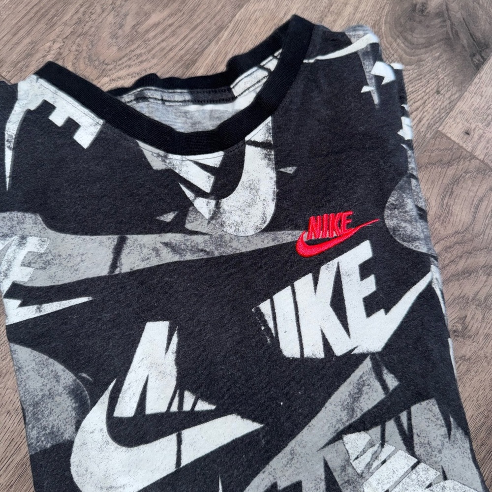 Nike BOYS Black Tee with White Logo All-Over Print and Pink Accent